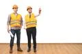 The two engineers gesture on the white wall background Photo