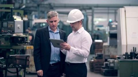 Two engineers at an industrial plant. Two workers control the work at the Stock Footage 171775442