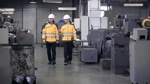 Two engineers at an industrial plant. Two workers control the work at the Stock Footage 171775556
