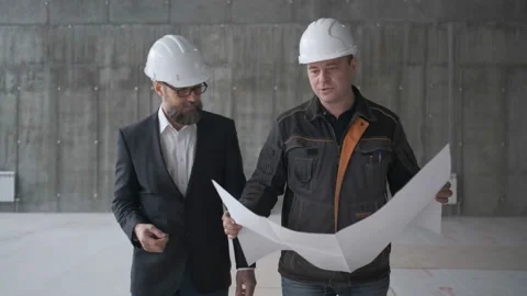 Two Engineers Meet At Construction And Consult Building Project. Two Engineers Stock Footage 106871986