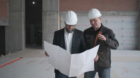 Two Engineers Meet At Construction And Consult Building Project. Two Engineers Stock Footage 106880505