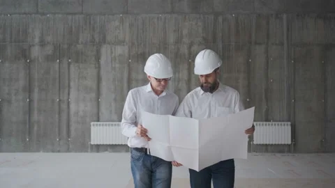 Two Engineers Meet At Construction And Consult Building Project. Two Engineers Stock Footage 106991773