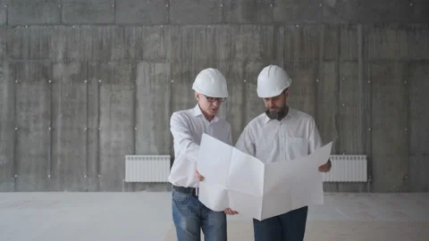 Two Engineers Meet At Construction And Consult Building Project. Two Engineers Stock Footage 107076995