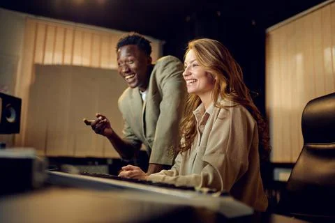 Two engineers at mixing console, recording studio Foto stock