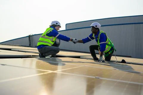 Two engineers technicians shacking hands together with successful project Foto stock