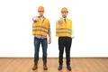 The two engineers thumb down on the white wall background Photo