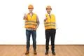 The two engineers thumb up on the white wall background Photo