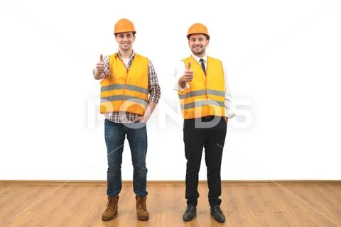 The two engineers thumb up on the white wall background Stock Photos