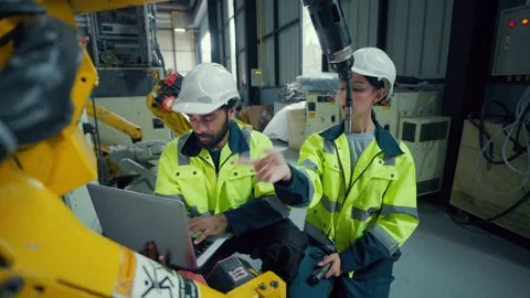 Two engineers wear hard hats and high-visibility vests Stock Footage 340987325