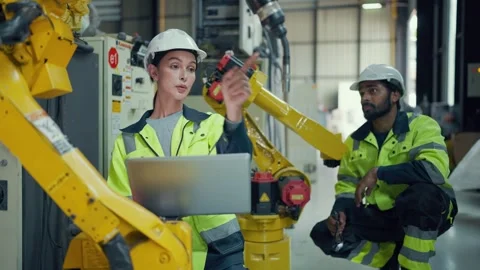 Two engineers wear hard hats and high-visibility vests Video stock 340987844