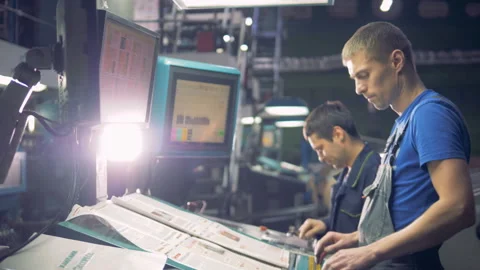 Two engineers working with industrial computerized equipment using touchscreen. Stock Footage 88805213