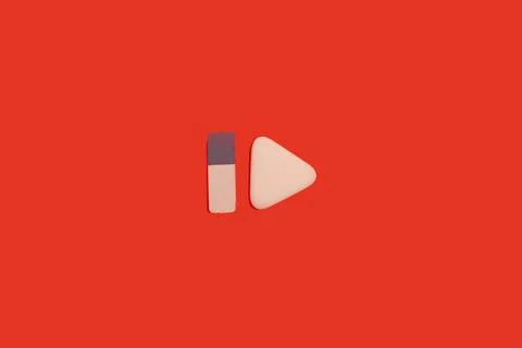 Two erasers on a red background. office accessories Stock Photos
