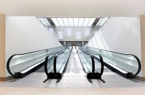 Two escalators in a commercial building Stock Photos