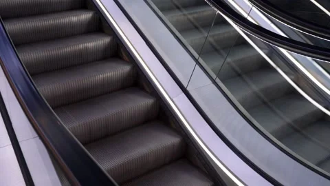 Two escalators rows, going both ways, person walks up Stock Footage 132827388