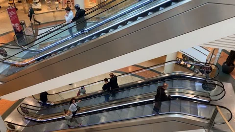 Two escalators sideways and from above taken in a shopping mall Stock Footage 108488660