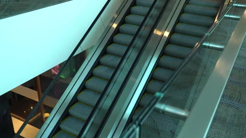Two escalators with yellow stripes are moving Vidéo 256260872