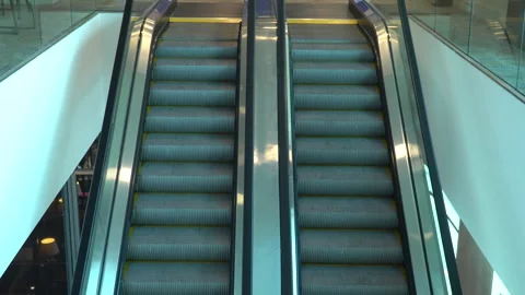 Two escalators with yellow stripes are moving Stock Footage 256261058