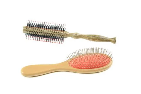 Two essential brushes one with black bristles and another with wire bristle.. Stock Photos