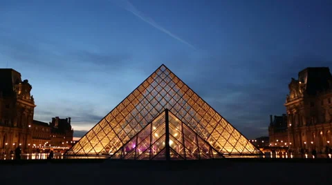 Two establishing shots of the pyramide at Louvre in Paris Stock Footage