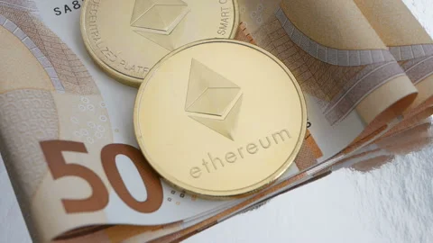 Two Ethereum ETH coins rotating on bills of Euro background, smart contracts Stock Footage 87605385