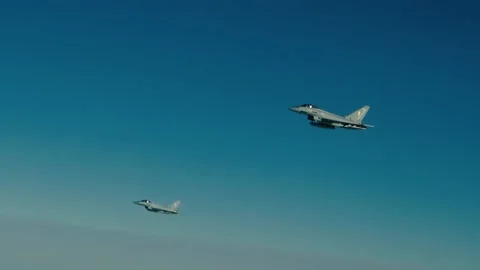 Two Eurofighter planes fly side by side Video stock 141209925
