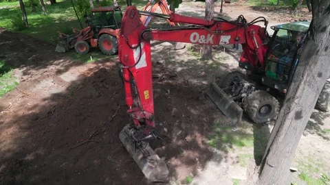 Two excavators are digging ground at construction site, crane shot. Stock Footage 76877695
