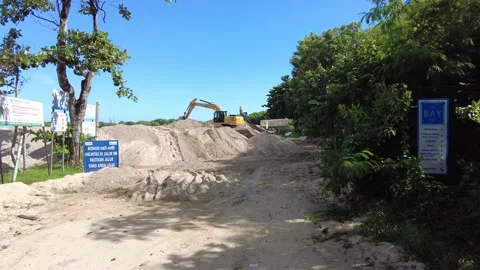 Two excavators are working on the ocean shore Video stock 231303706