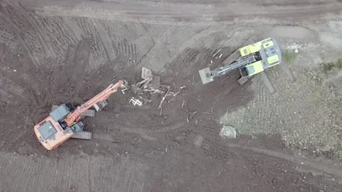 Two excavators dig the ground drone view Stock Footage 169323944