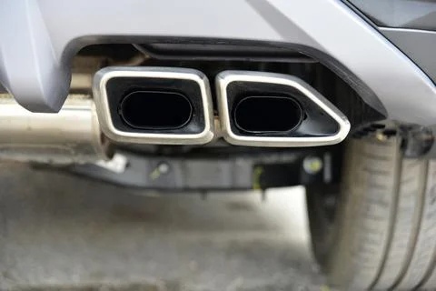 Two exhaust pipes of a passenger car Stock Photos