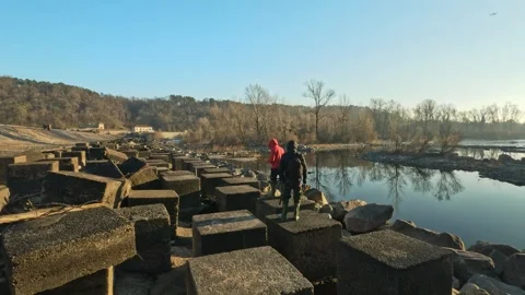 Two explorers near the Panperduto dam Stock Footage 295754853