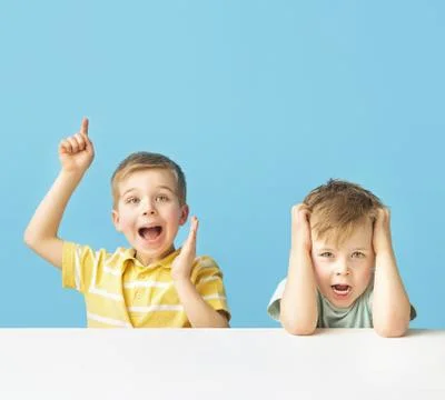Two expressive boys posing together Stock Photos