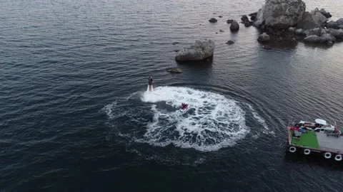 Two extremals is using flyboards on Black sea in summer day in Crimea. Stock-Footage 167448904