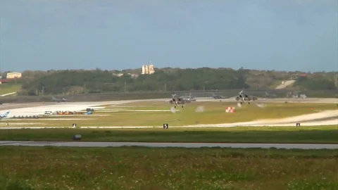 Two F-15 Eagles taking off in tandem from Anderson AFB, Guam Stock Footage 104188844