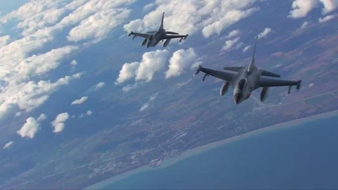 Two F-16 fighter jets fly in formation. Video stock 74798360