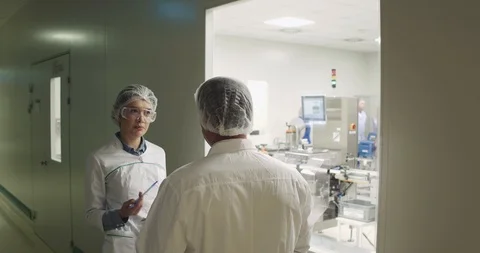 Two factory workers discussing on laboratory test. Stock Footage 101097516