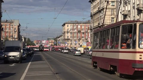 Two fast running trams meet at centrally located segregation Stock Footage 67468281