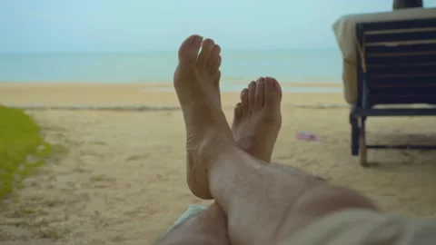 Two feet closeup on the white sand beach blue sky and sea on a holiday Stock Footage 290217606