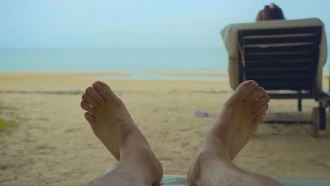 Two feet closeup on the white sand beach blue sky and sea on a holiday Video stock 290218235