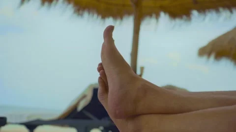 Two feet closeup on the white sand beach blue sky and sea on a holiday Video stock 290218563