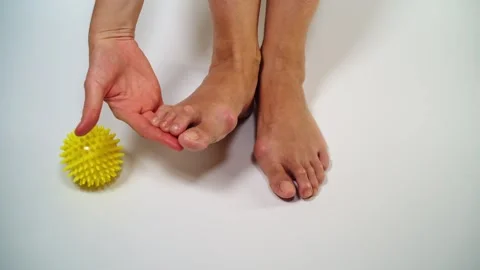Two feet with one ball, pointing to problem areas. Stock Footage 255611440