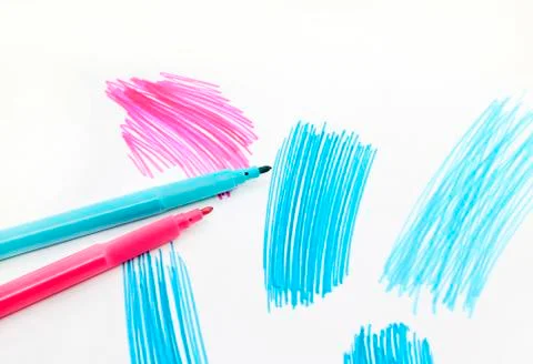 Two felt-tip pens on a white background with abstract drawings Stock Photos