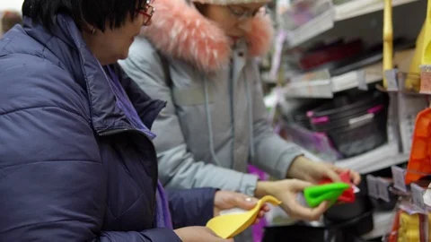 Two female customers choose kitchen accessories in the hardware store. Stock Footage 99044581