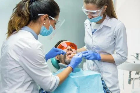 Two female dentists at work. Stock Photos