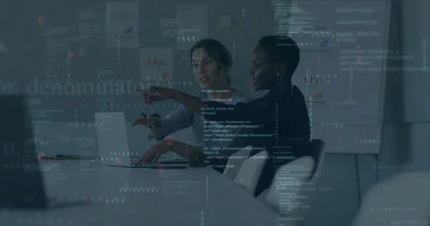 Two female developers pointing at laptop and initiating coding while aligning Stock Footage 312019110