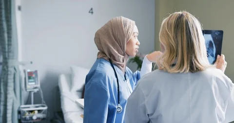 Two female doctors discussing x-rays 4k Stock Footage 112035053