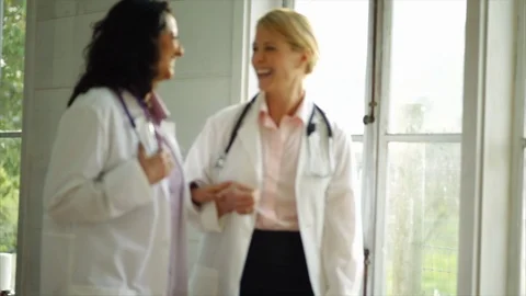 Two female doctors talking. 스톡 동영상 88405835