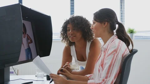 Two Female Editors Working At Computer Using Graphics Tablet In Post Production 스톡 동영상 119844728