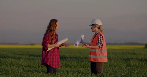 Two female Engineers talking and shaking hand at construction site. Stock Footage 204051242