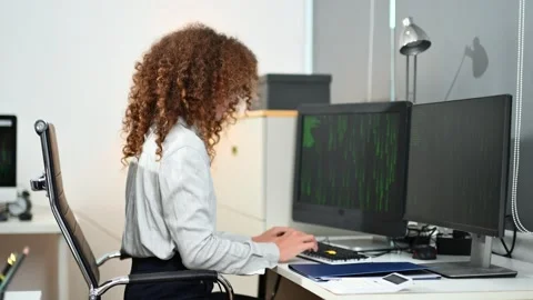 Two female fintech developers collaborating on finance apps, data analytics.. Stock Footage 312387416