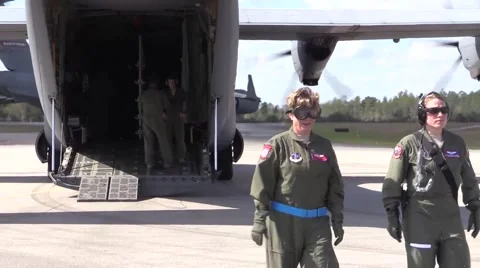 Two Female Flight Nurses Walk Away from Hercules C-130 Stock Footage 56646453